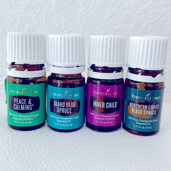 4 opened 5ml Young Living essential oils and mini booklet